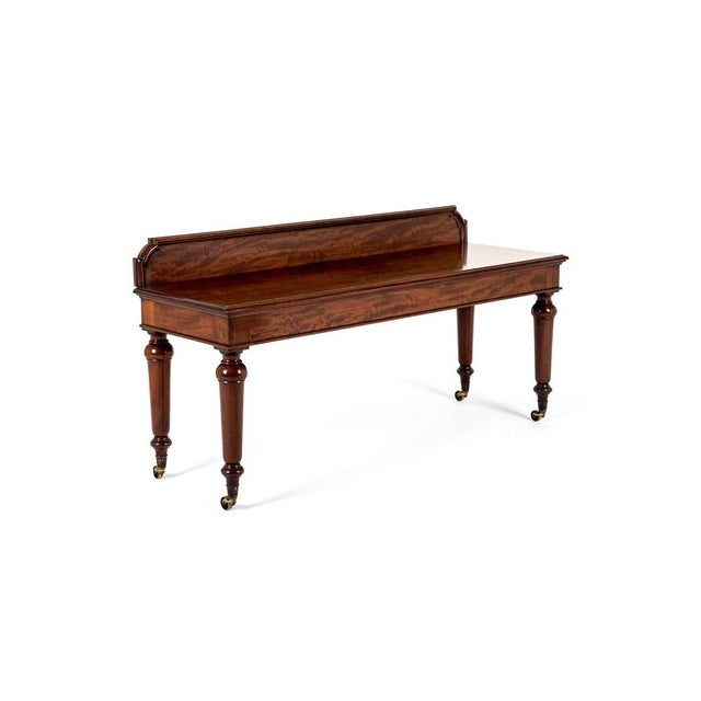 A superb well proportioned mahogany serving table by john taylor & son edinburgh. The generous slab top has a gentle...