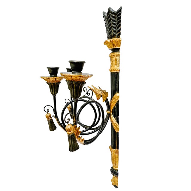 A dramatic vintage Italian wall sconce, featuring a masterful blend of neoclassical symbolism and Hollywood Regency...