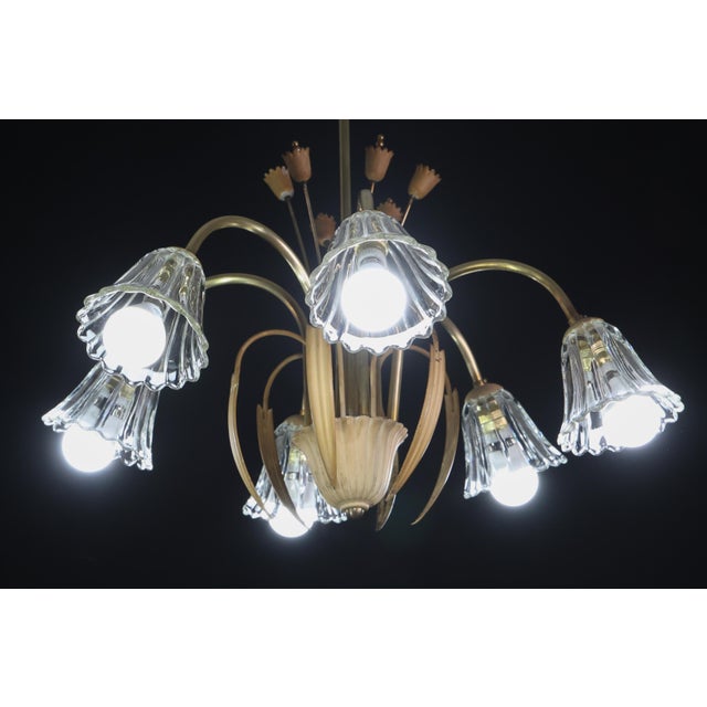 Chandelier with a brass frame and 6 Murano glass shades. Manufactured between 1940 and 1950. The chandelier has been fully...