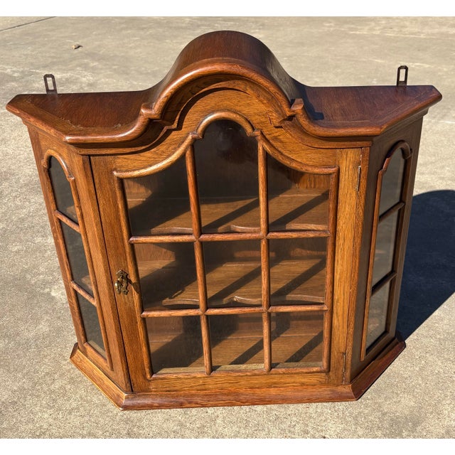 Nice vintage Dutch locking wall cabinet with divided glass door and two shelves. And I do have the key!