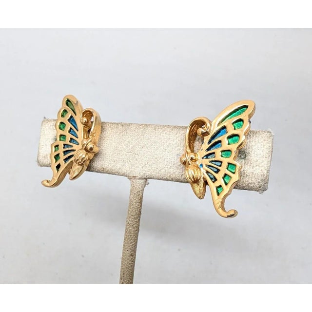 Late 1960s goldtone blue and green enamel butterfly clip earrings. Marked "NAPIER" on the clips. Measure: 1 1/16 inches...
