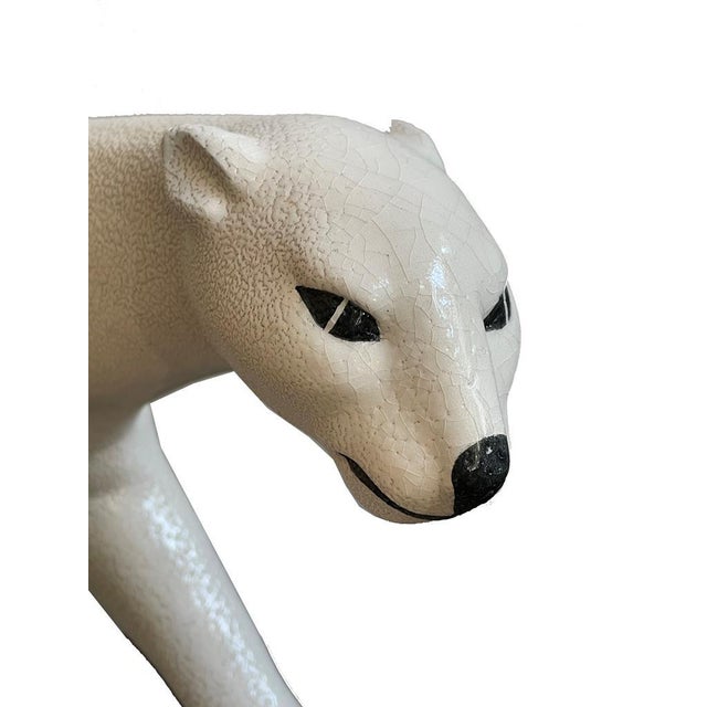 Striding female Art Deco panther in white ceramic White Art Déco panther, faience France, dated on the underside: “1929”...