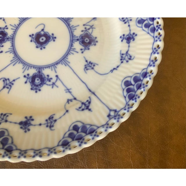 total of 8 available; hand painted cobalt blue floral motifs; distinctive ribbed (fluted) texture hand pierced open work...