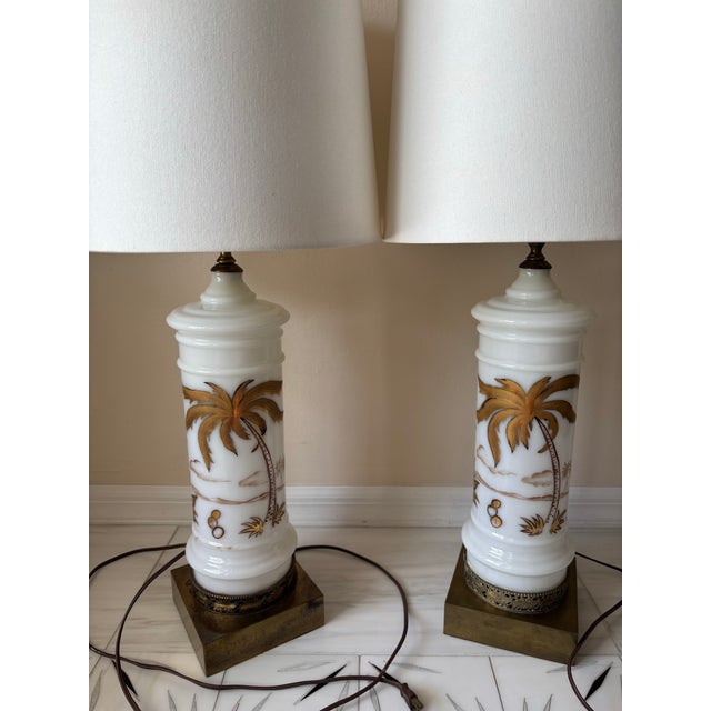 Bring timeless Palm Beach style to your space with this striking pair of vintage hand-painted white opaline table lamps....
