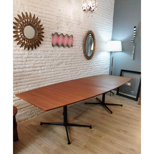 Large conference or dining table by Italian designer Osvaldo Borsani, produced by Tecno. Smooth-grained, honey-colored...