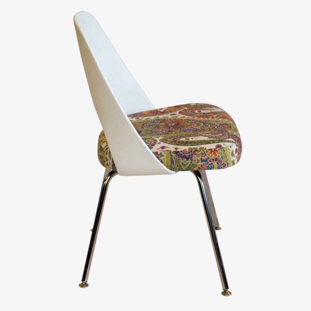 Gorgeous paisley fabric has been used to reupholster is vintage Eero Saarinen for Knoll plastic-back chair with chrome...
