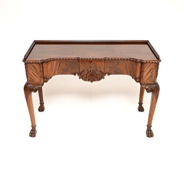 A superb antique Queen Anne style console table by Hille of London. This was made in England and dates from around the...