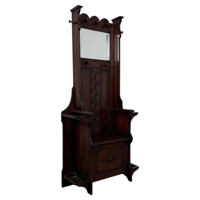 An impressive and highly practical early 20th-century English Edwardian hall stand, beautifully crafted in richly grained...