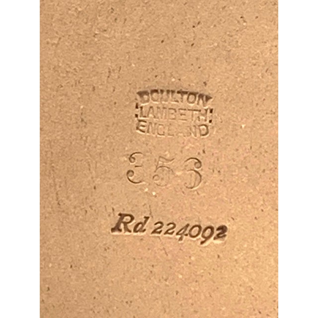 What a find! RARE. Royal Doulton produced this whiskey jug for Dewars and Sons Whiskey Distillery in 1894. The jug is 1/4...