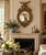 A beautiful large Federal-style convex mirror, crowned by a finely modeled spread-wing eagle above an elaborate...