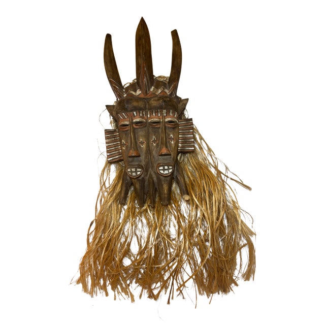 Late 19th Century West African Double-Faced Carved Wood Mask With Raffia and Cowrie Shells For Sale