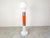 Very rare and striking mid century floor lamp by Mazzega made ou tof orange and white murano glass with two metal rings....