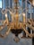 Elegant eight light Murano chandelier in light amber color works in myriad decorative styles
