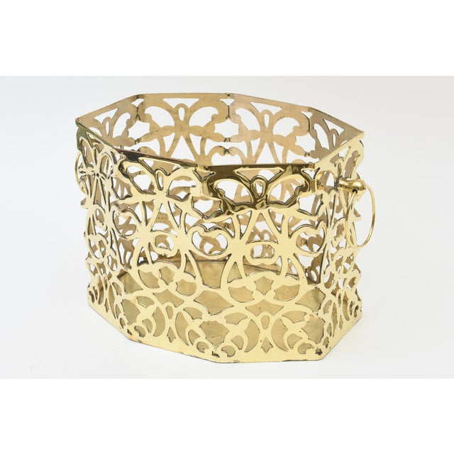 This ultra chic solid brass vintage plant or orchid holder/ container or stand has 2 rings on either side. From the 50's...