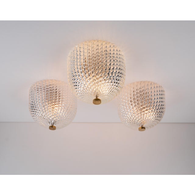 Art deco venini murano glass celling lamps, made in italy in 1940s. The lamps consist of massive embossed murano glass...