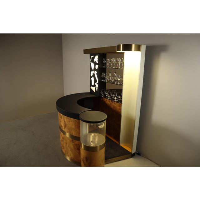 An exceptional Italian cocktail bar from the 1970s, distinguished by its sculptural design, richly figured burl wood...