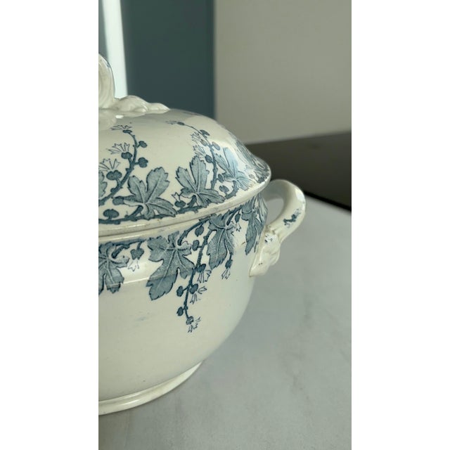 A beautiful antique Lunéville earthenware tureen, Neva pattern, recognizable by its elegant blue floral design on a cream...