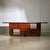 Introducing a piece of vintage elegance: this Italian walnut sideboard from the 1970s, designed for Mobil Girgi. It...