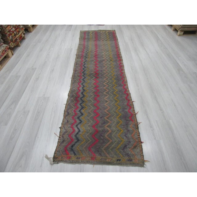Handwoven vintage decorative kilim runner rug from the Adana region of Turkey. Approximately 45-55 years old. In very good...