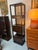 Tall Cabinet perfect to use for storage and display! Drawer fronts and surfaces have a faux finish. Outer construction is...