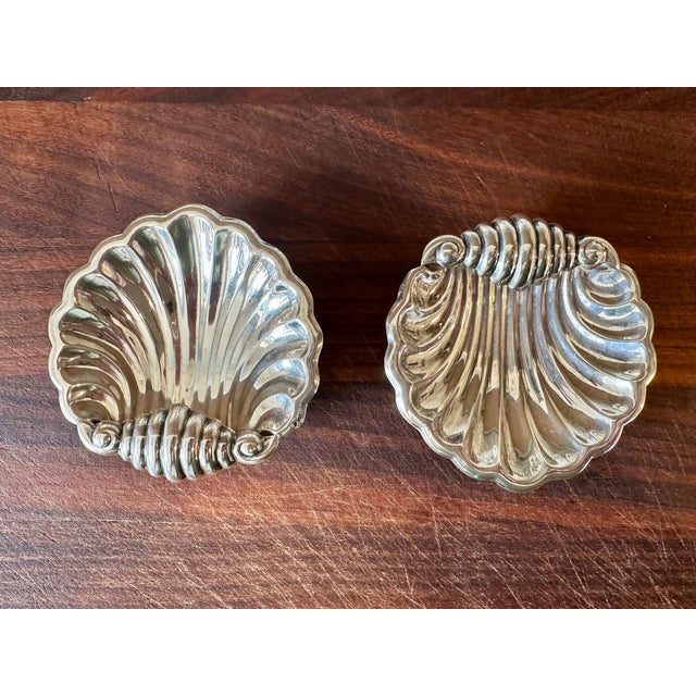 Charming pair of small silver plate shell form dishes - perfect on an end table, a night table to hold jewelry, or a...