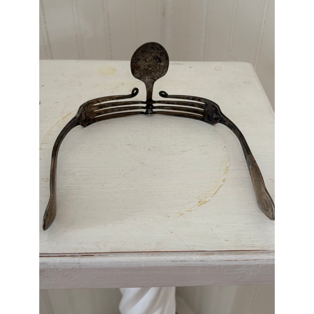 These whimsical glasses are from the 1930s made from 2 silver forks and 1 spoon. They are created to form the shape of...