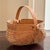 Offering a small handwoven splint oak buttocks basket made by artisans in Coker Creek, Tennessee. Beautifully constructed...