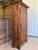 A wonderfully timeworn 18th-century French Provincial bonnetière or single-door armoire, dating to approximately the late...