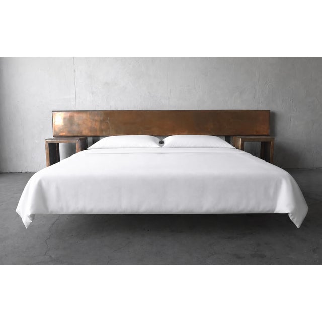 Striking in both scale and materiality, this 1970s bedroom suite features a monumental handcrafted copper headboard paired...