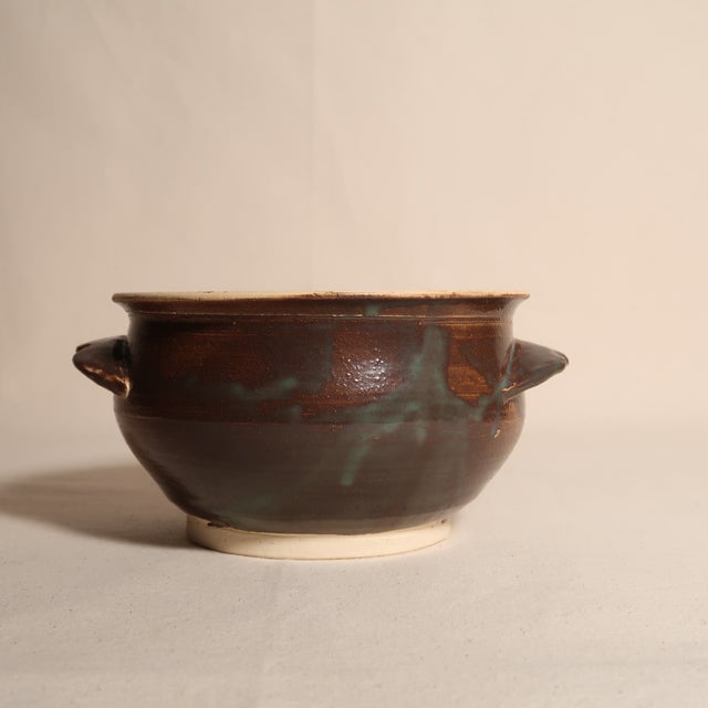 A beautifully hand-thrown studio pottery bowl signed “Patsy ’05,” showcasing the warmth and individuality of contemporary...