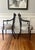 A pair of beautiful, vintage Federal style arm chairs. This pair of matching chairs includes a straight crest rail with...