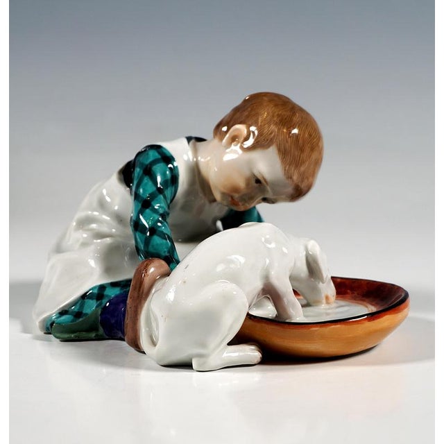 Art nouveau meissen porcelain figure from the time the model was created: boy with brunette hair, dressed in typical...
