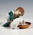 Art nouveau meissen porcelain figure from the time the model was created: boy with brunette hair, dressed in typical...