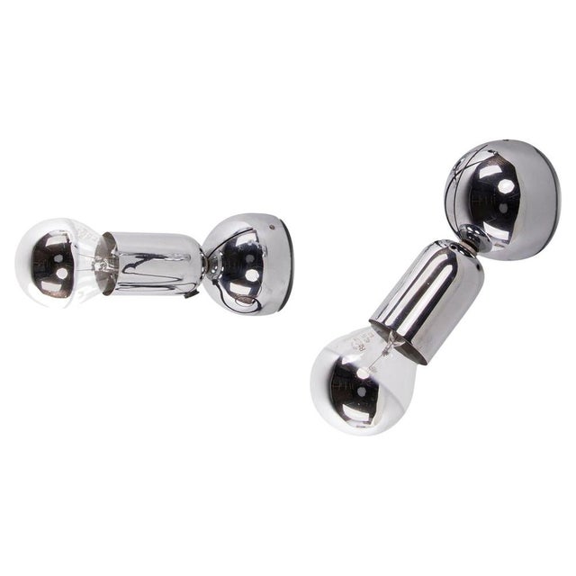 Elegant pair of minimalist adjustable chromed wall sconces and table lamps. Model 'pollux' designed 1967 by ingo maurer,...