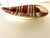 Beautiful and rare Bitossi ashtray/dish. Scratch texture surface with 24 k gold highlights around the reds and pinks....