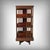This English revolving mahogany bookcase is a refined piece, combining decorative elegance and ingenuity. It rests on a...