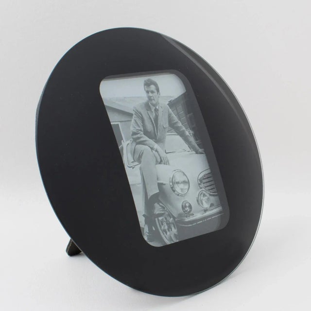Space Age black glass picture photo frame., circa 1960 Round domed design with kinetic effect. The easel and back are...
