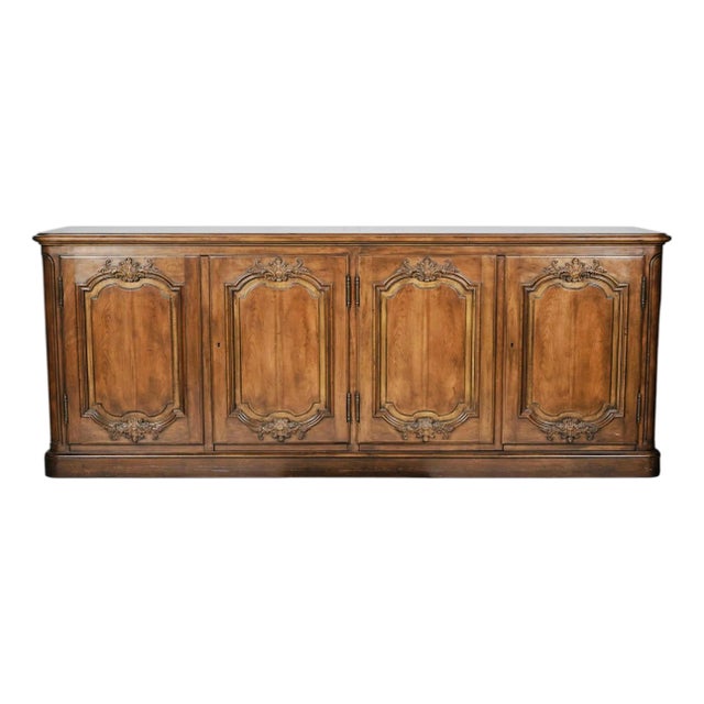 Monumental Baker Furniture French Provincial Style Walnut Buffet Sideboard, 4-Door Carved Credenza, Circa 1960–1975 For Sale