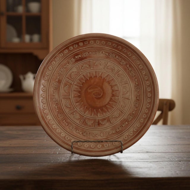 A fabulous terra cotta studio pottery centerpiece low-bowl. The design is thrown on a potter's wheel then embossed with...