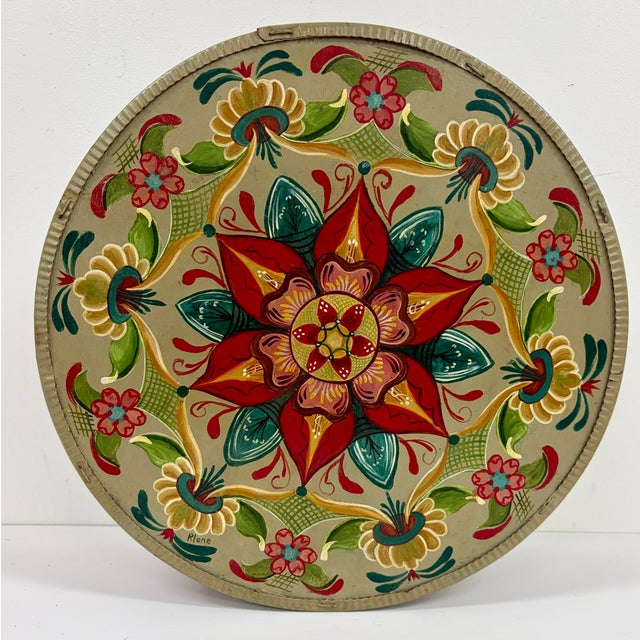 Vintage round wooden cheese box featuring a hand-painted floral folk art design in red, green, teal, yellow, and cream....