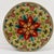 Vintage round wooden cheese box featuring a hand-painted floral folk art design in red, green, teal, yellow, and cream....