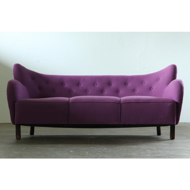 A charming and highly sculptural Danish sofa attributed to the design tradition of Flemming Lassen and Fritz Hansen. While...