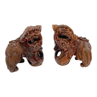 Early 20th Century Chinese Carved Hardwood Foo Dogs With Rolling Pearls & Puzzle Balls - a Pair For Sale