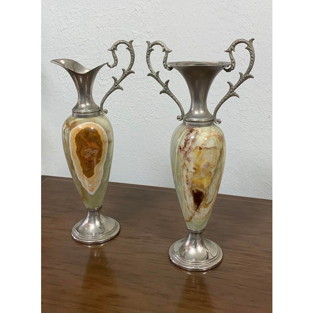 This exquisite pair of vintage urn-shaped vases is crafted from richly patterned green onyx, beautifully accented with...