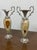 This exquisite pair of vintage urn-shaped vases is crafted from richly patterned green onyx, beautifully accented with...