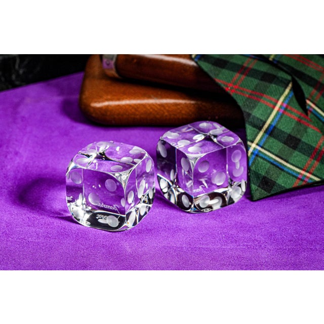 A fantastic and rare pair of oversized clear crystal dice, beautifully crafted by the renowned French glassmaker Baccarat....