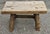 An Early American Style Rustic Stretcher Pine Log Bench. Measures 28.5" in width, 17" in depth and 17.5" in height.