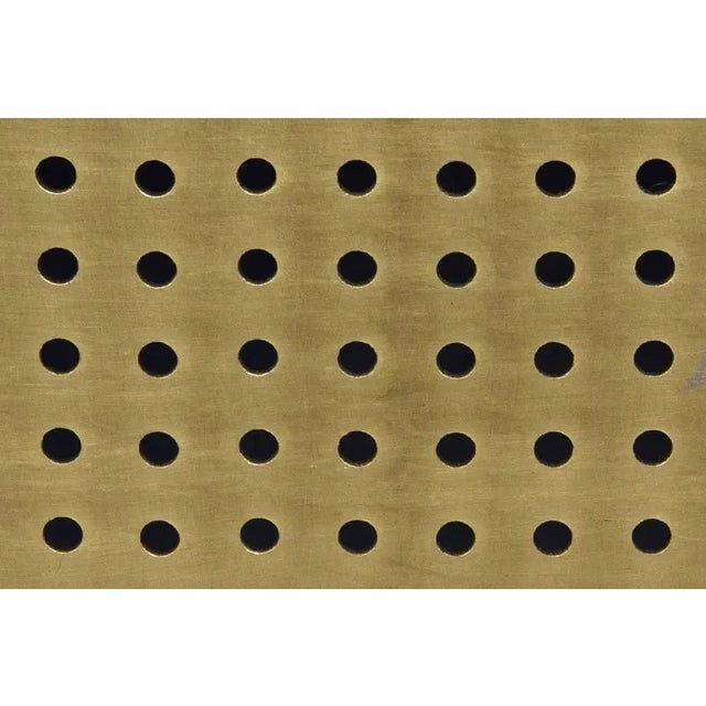 Handcrafted of metal with contrasting brass and black details, this architecturally inspired lamp from Noir has a striking...