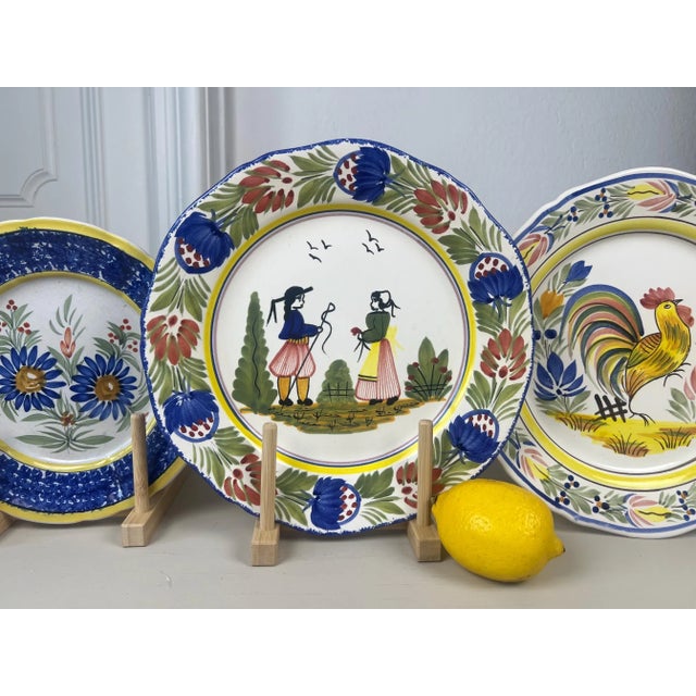 Beautiful large HB Quimper hand-painted faience plate featuring a traditional Breton couple in regional costume. At the...
