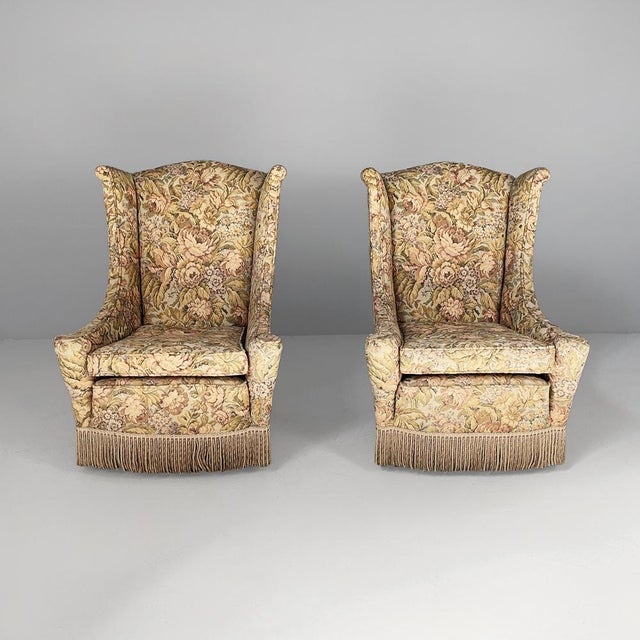 Italian mid-century modern armchairs in wood and fabric, 1950s Pair of fabric armchairs with a floral motif. They feature...